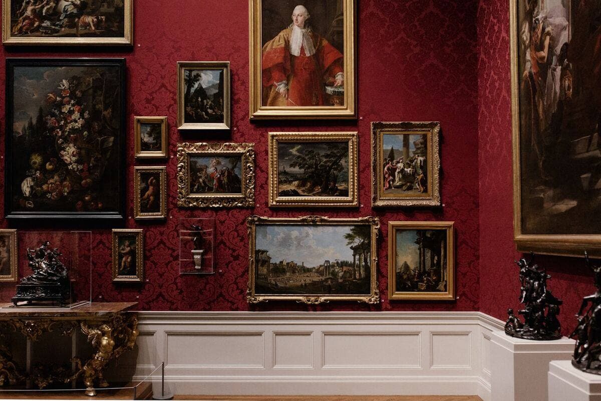 Museum visitors walking through a gallery exhibition